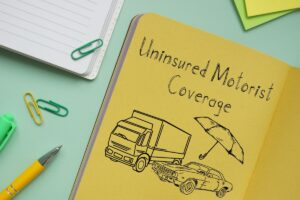 Uninsured motorist coverage concept illustration with car accident sketch and umbrella protection symbol