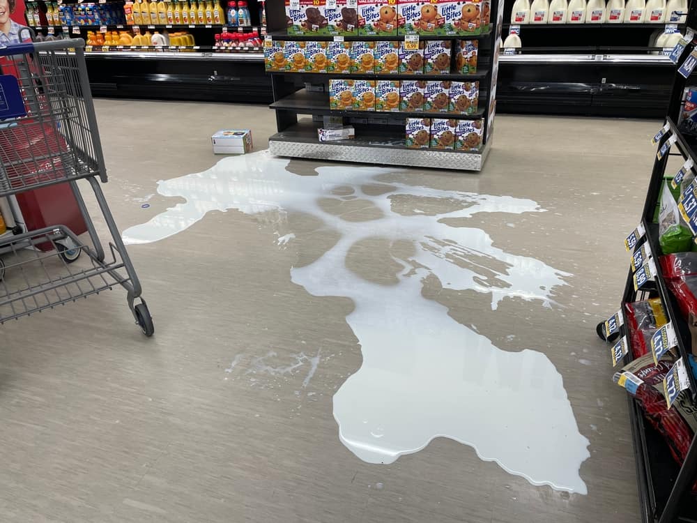 Grocery store spilled milk in dairy area
