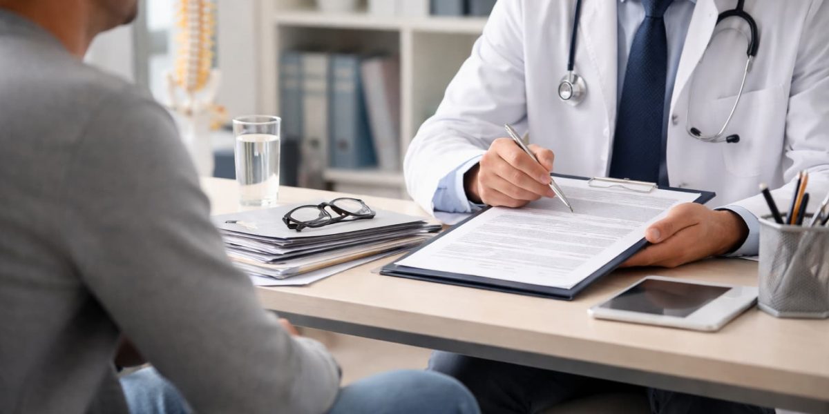Insurance defense doctor conducting a medical examination consultation for a traumatic brain injury claim